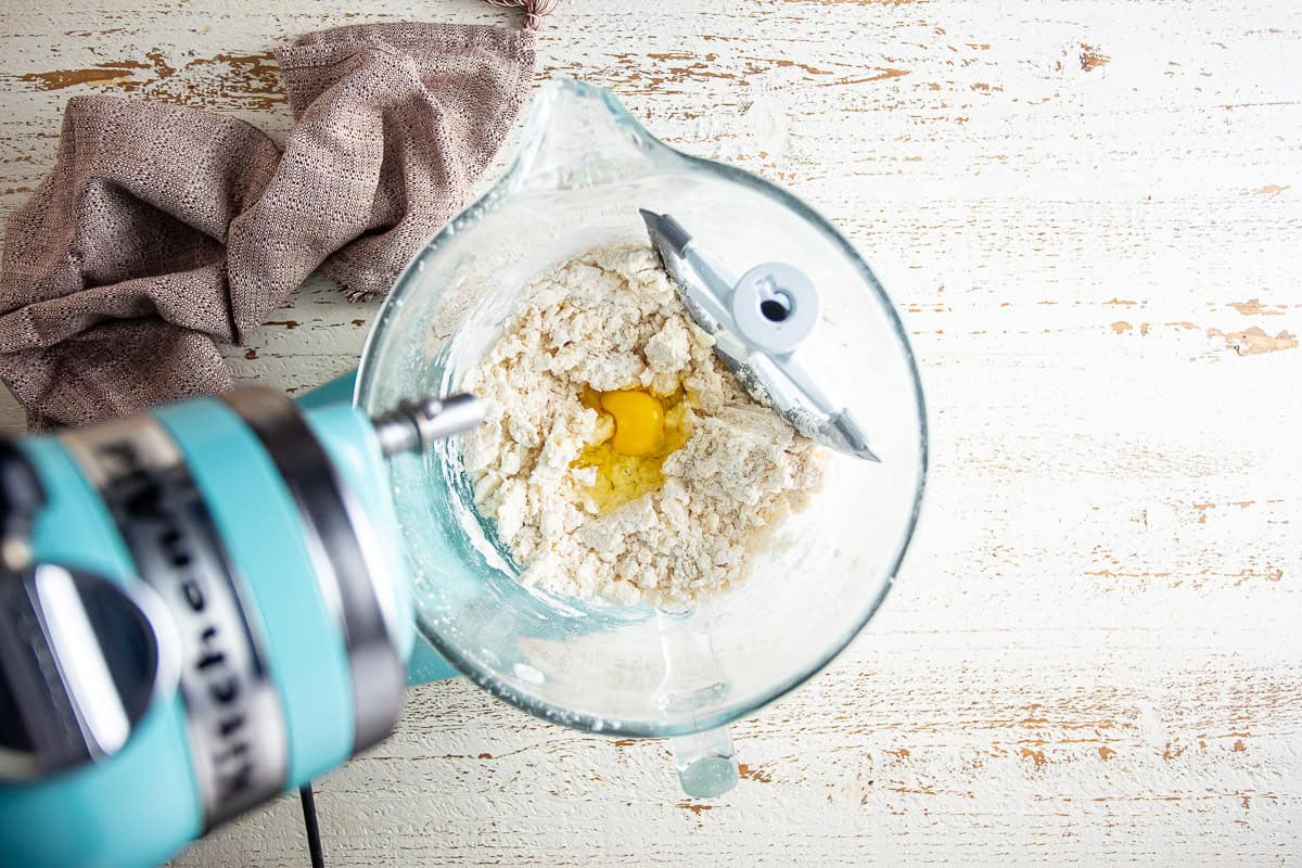 Adding the first egg to the maple cake batter