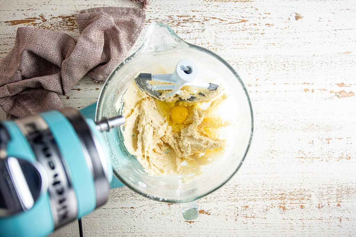 Adding the second egg to the maple cake batter