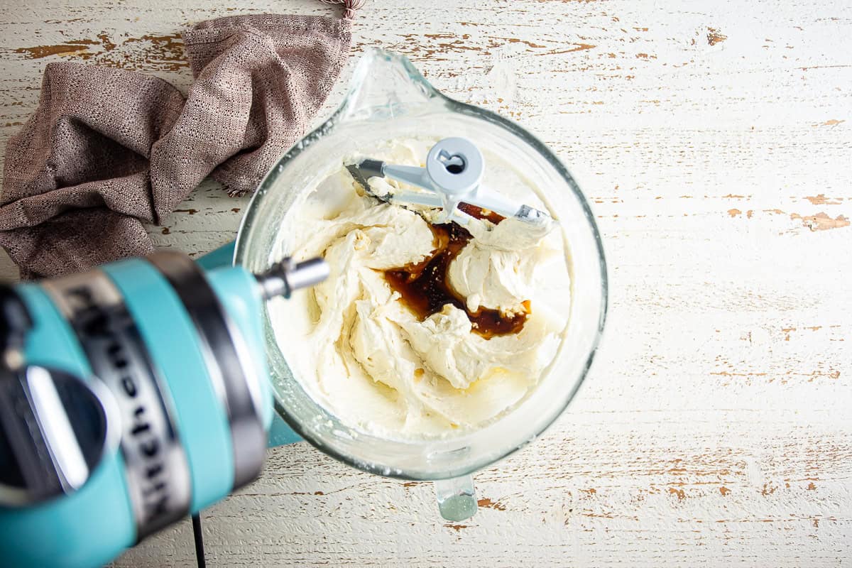 Adding maple syrup and extract to the cake maple cake batter