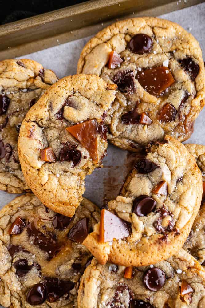 Brown Butter Chocolate Chip Cookies with Toffee with one cookie broken in half
