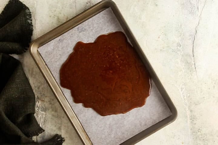 Toffee mixture poured onto a prepped tray for cooling and hardening