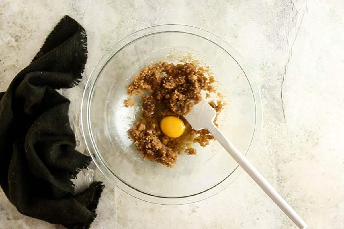 Adding egg to the sugar and butter mixture