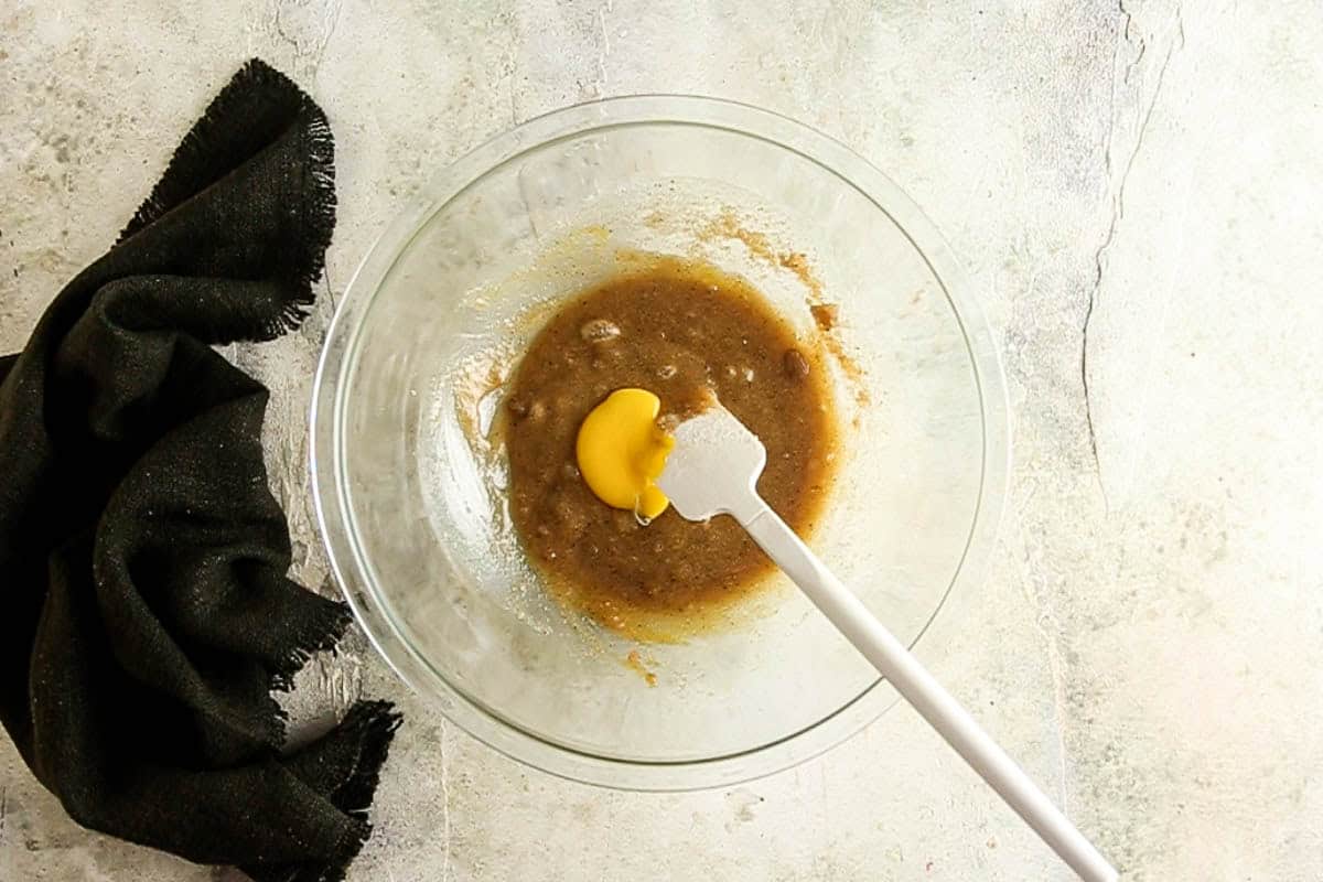 Adding egg yolk to the cookie dough