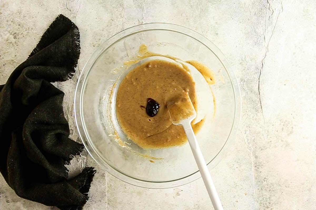 Adding vanilla to the cookie dough