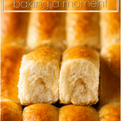 Close-up of freshly baked Parker House rolls with golden crust and soft interior.