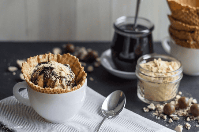 Chocolate fudge banana pudding parfait with crumbled cookies in a tart shell.